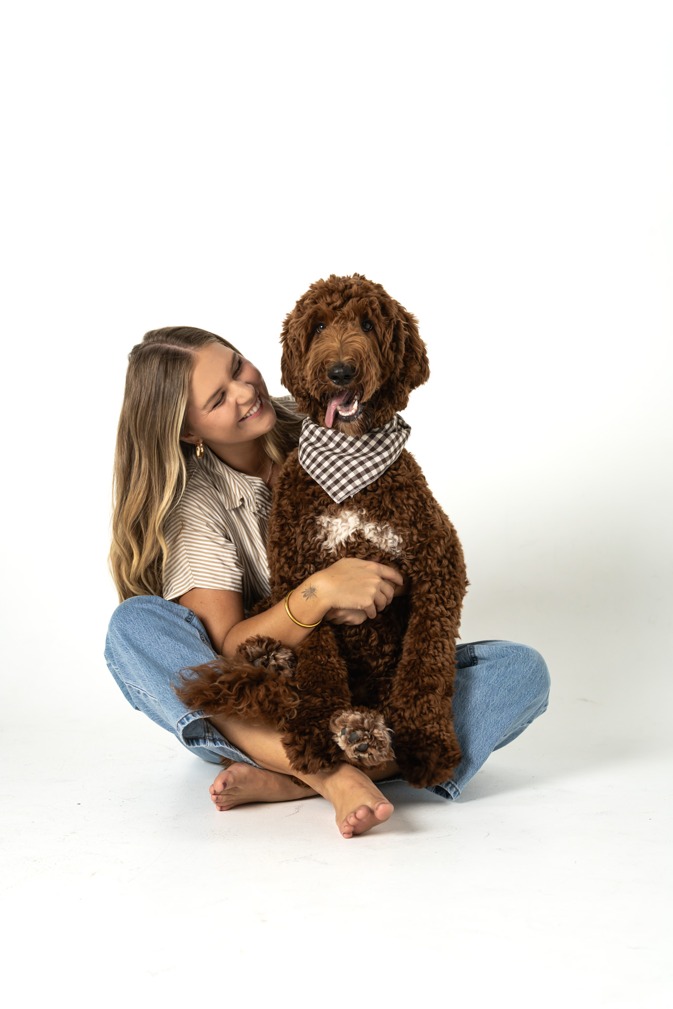 Benson being held while his person looks at him